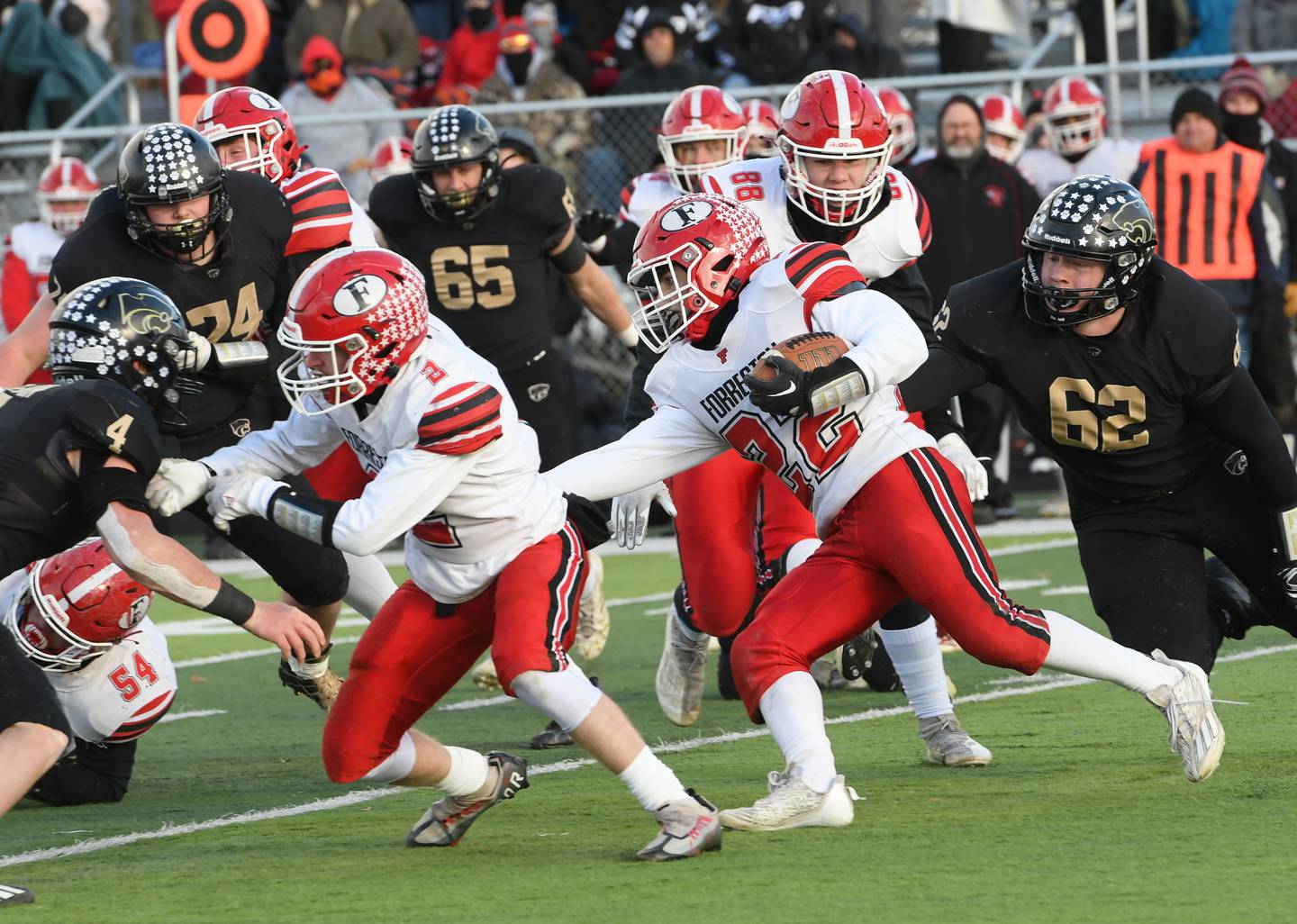 Forreston's Kaleb Sanders follows blocker Quinten Frederick as he looks for gap in the line against Lena-Winslow at the 1A semifinal in Freeport on Saturday, Nov. 19. The Panthers ended the Cardinals season willing the game 38-16 to advance to the state championship game next Friday in Champaign.