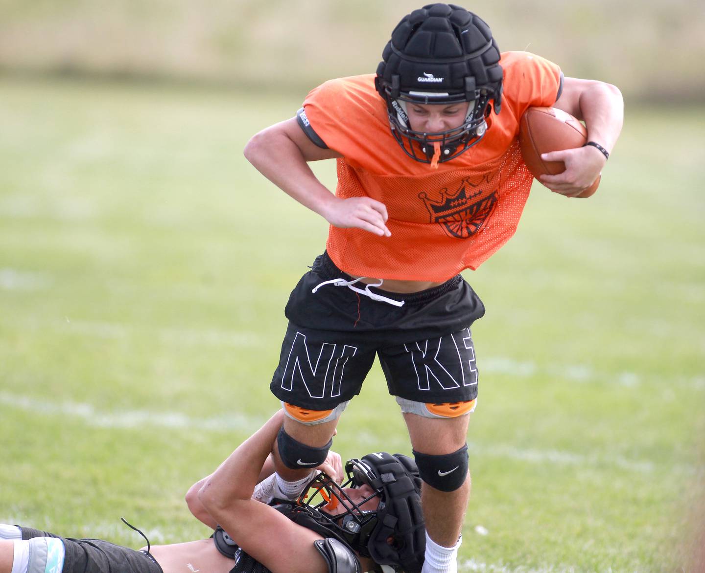 St. Charles East’s Xander Salazar is tackled with the ball during a practice on Thursday, Aug. 22, 2024 in St. Charles.