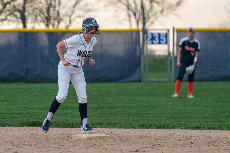 Oswego East's Finley Anderson (15) reacts after hitting a double against Oswego during a softball game at Oswego East High School on Wednesday, April 19, 2023.
