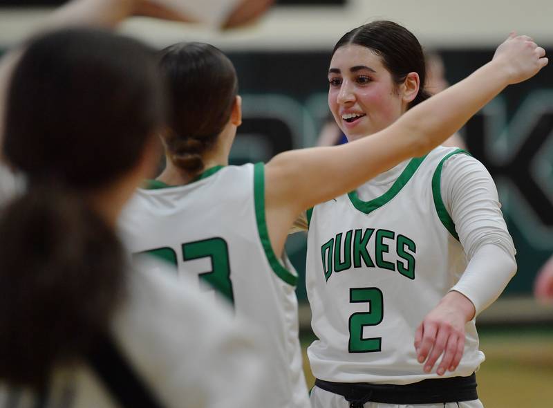 York’s Anna Filosa (2) is greeted by teammates after scoring to exceed 1000 career points during a game against Lyons Township on February 4, 2025 at York High School in Elmhurst.