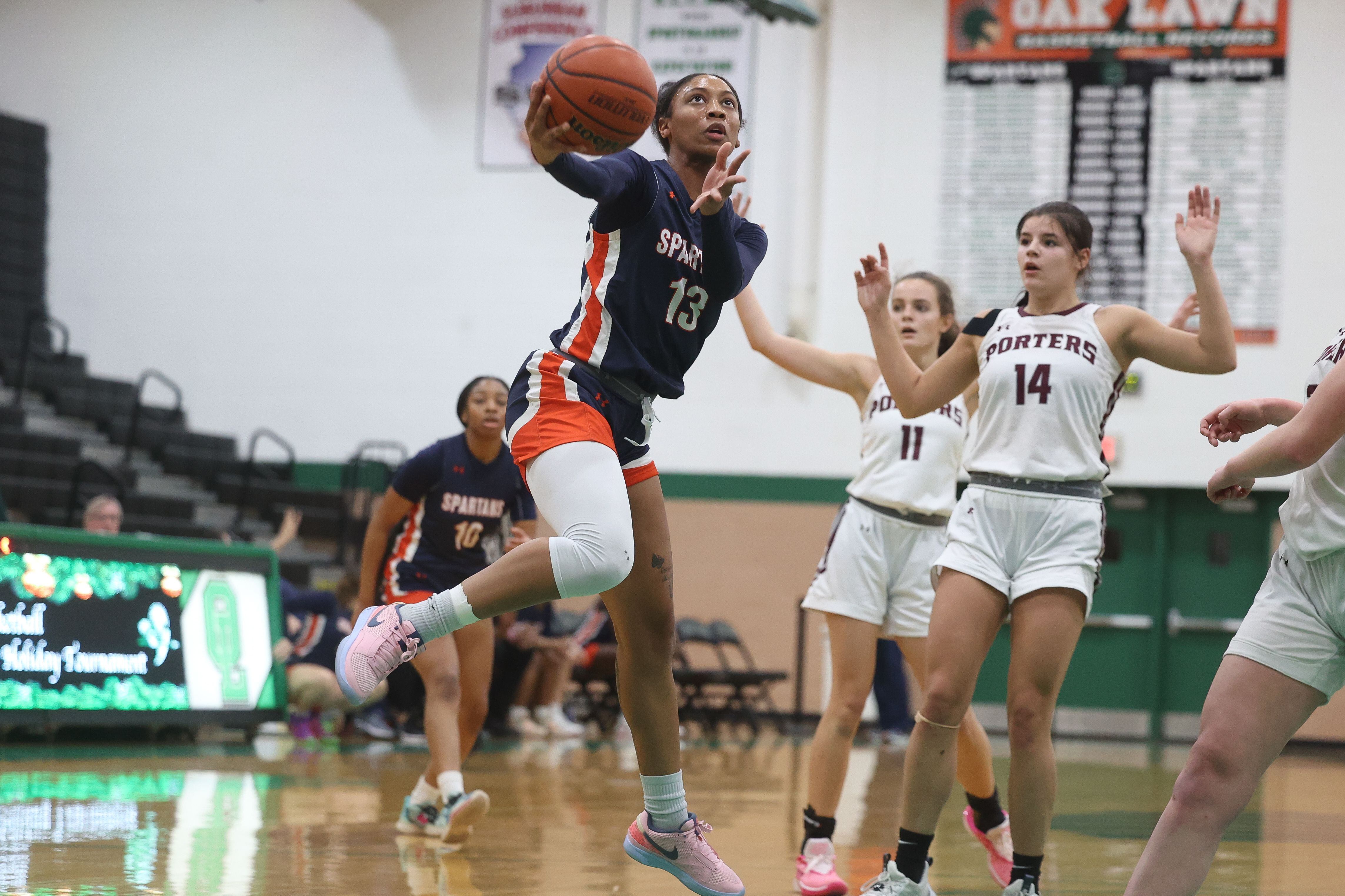 Romeoville’s Jadea Johnson flips up a shot against Lockport in the Oak Lawn Holiday Tournament championship on Saturday, Dec.16th in Oak Lawn.