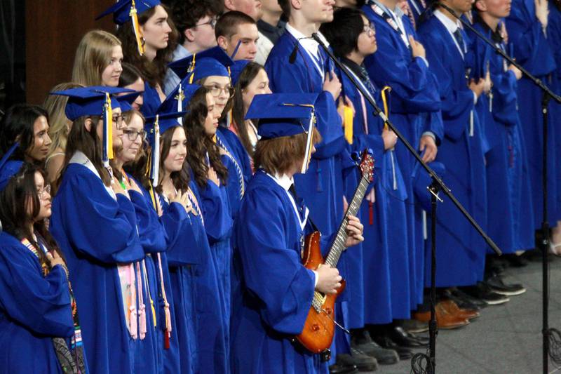 Geneva High School graduate Dax Nichols plays the Star Spangled Banner on the electric guitar during the school’s commencement ceremony on Tuesday, June 3, 2025 at Northern Illinois University in DeKalb.