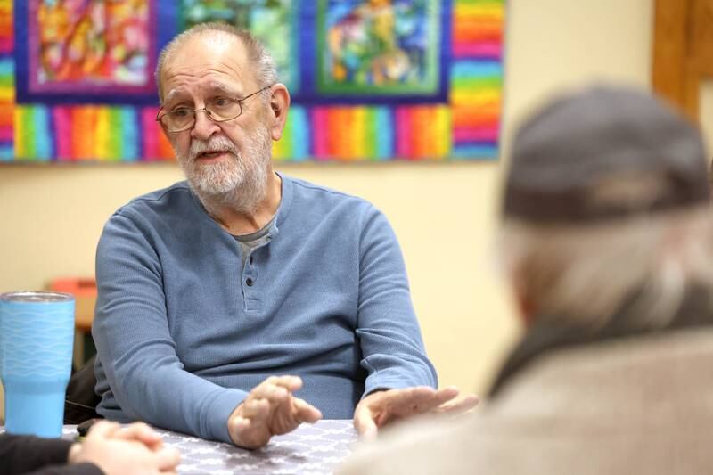 David Diaz, with the Unitarian Universalist Congregation of DeKalb and a volunteer at the warming center, talks Thursday, Jan. 23, 2025, at the church, about the center. The warming center, which is open nightly during the winter months, offers free hot meals to all and a warm, safe place for those who need a refuge from the cold.