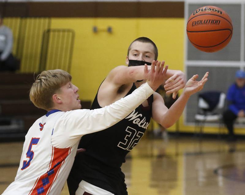 Hoffman Estates’ Connor Kurzynski applies pressure to Prairie Ridge's Kevin Fist as he passes the ball during a Hinkle Holiday Classic basketball game Wednesday, Dec. 28, 2022, at Jacobs High School in Algonquin.