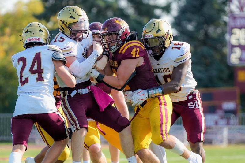Loyola's Will Mettee makes a tackle during a game against St. Ignatius.