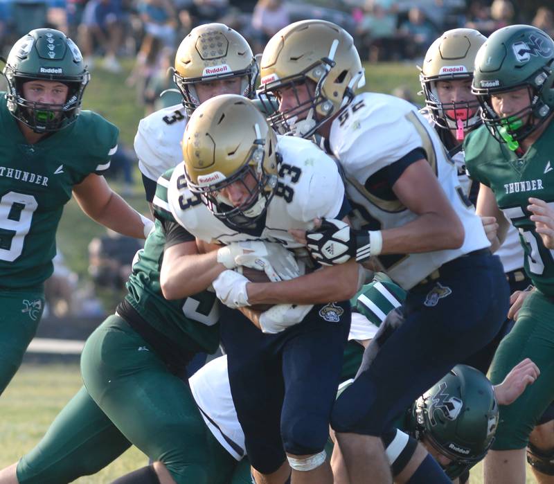 Polo's Mercer Mumford (83) runs with the ball as Ehtan Dewey (52) pushes from behind against West Carroll in 8-man football action in Mt. Carroll on Friday, Sept. 12, 2025.