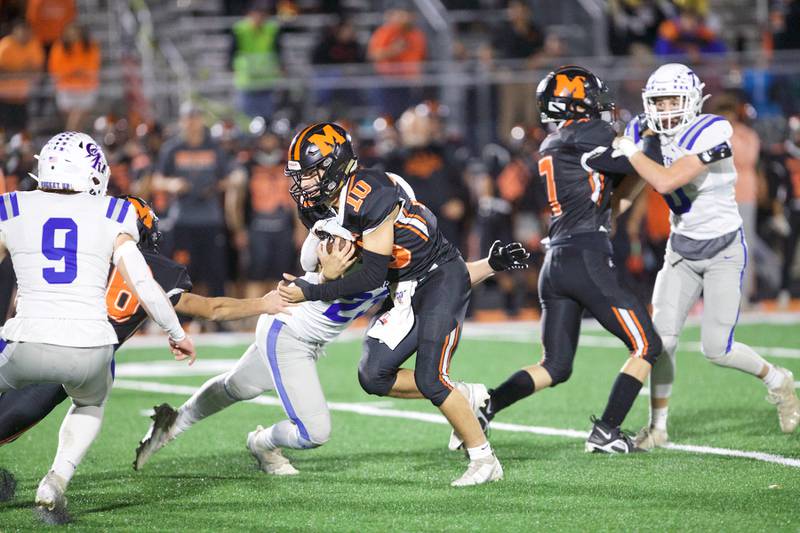 McHenry's Dominick Caruso is tackled by Burlington Central's Zachary Samaan on Friday, Oct. 21,2022 in McHenry.