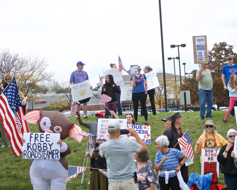 Locals gather at the NO Kings rally along Randall Rd. on Saturday, Oct.18,2025 in Geneva.