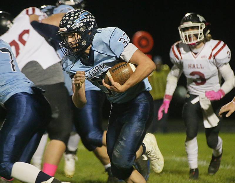 Bureau Valley's Jaden Michlig (no,32) runs the ball against Hall on Friday Oct. 22, 2021.