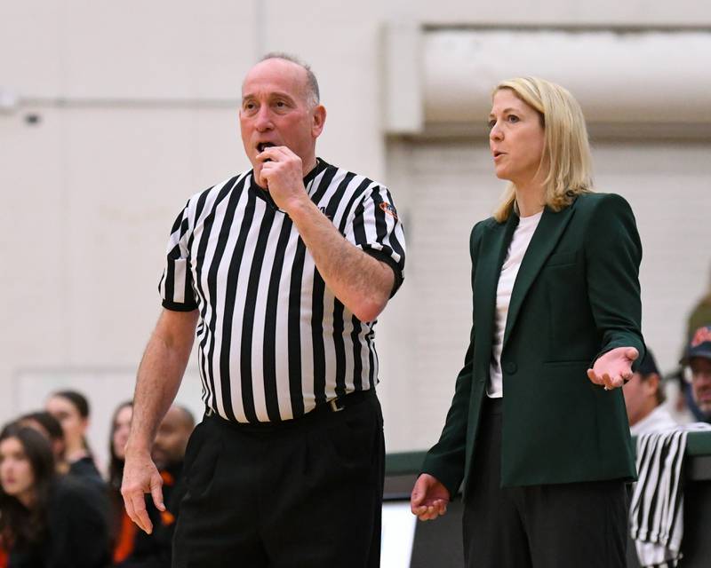 Glenbard West's head coach Kristi Faulkner talks with the official during a break in the action on Thursday Feb. 26, 2026, during the 4A Sectional championship game held at Bartlett High School.