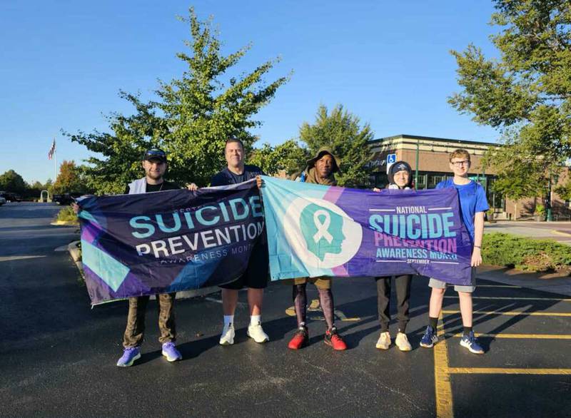 From left to right, Jake Smith, Shaun Brav, Derek Grant, Emily Hermann and Lincoln Medland pose for a photo while participating in Smith's annual walk for mental health and suicide prevention awareness on Sept. 6, 2025.