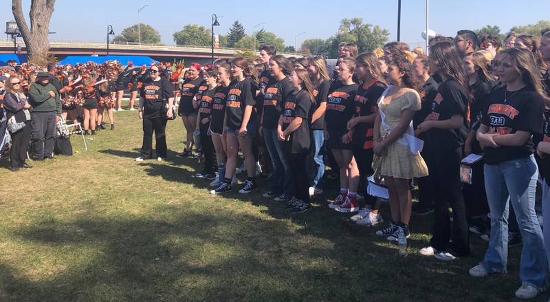 The McHenry High School Choir performs the national anthem at the Homecoming rally at Miller Point Park in McHenry Oct. 6, 2024.
