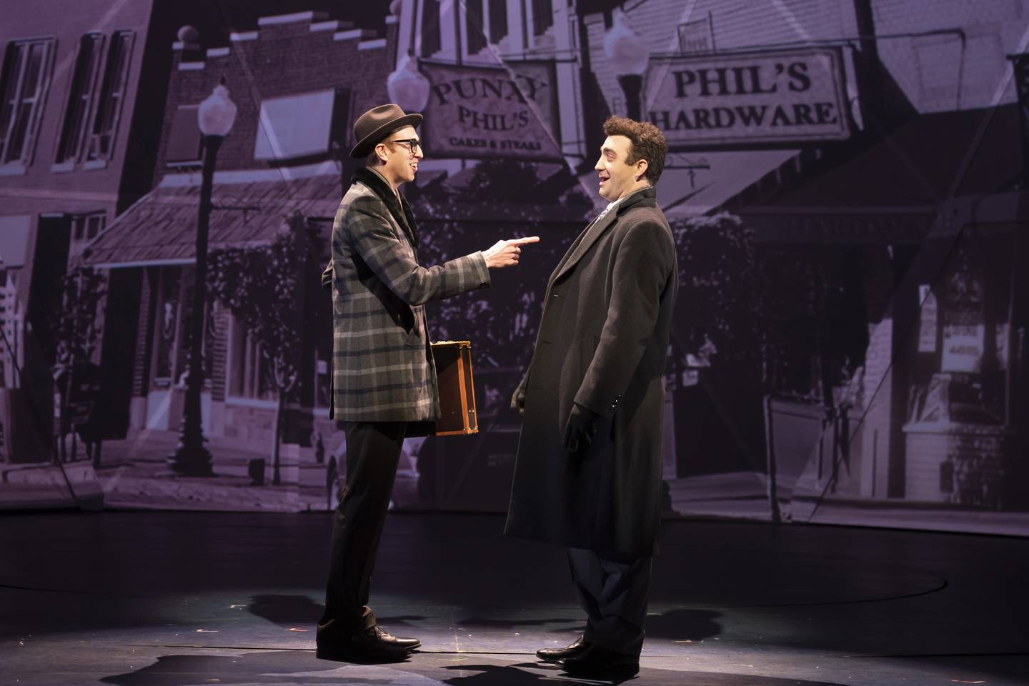 (from left) Kyle Adams plays insurance salesman Ned Ryerson and Alex Syiek plays TV weatherman Phil Connors in Paramount Theatre’s Midwest regional premiere of Groundhog Day: The Musical, playing now through March 13, 2022. For tickets and information, visit ParamountAurora.com, or call the Paramount box office, (630) 896-6666. Credit: Liz Lauren