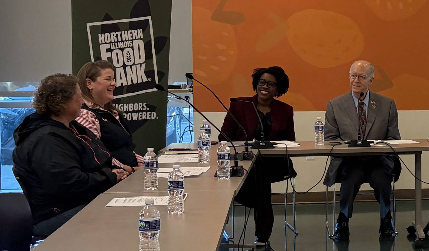U.S. Reps. Bill Foster (right) and Lauren Underwood (center) participate in a roundtable discussion about SNAP cuts on Friday, Nov. 7, 2025, at the Northern Illinois Food Bank in Geneva.