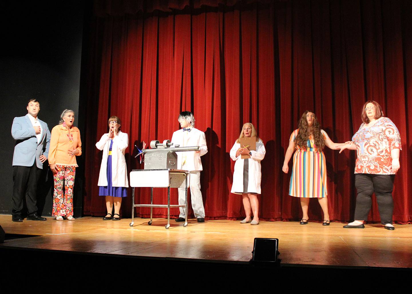 Students react to the success of the "Intermo" test in Engle Lane's performance of "Get Smart." They are (left to right) Ken Persky, Mary Ann Neuman, Georgia Darby, Corbin Shaver, Carol McConville, Kelli Mulstadt and Lisa Gill.