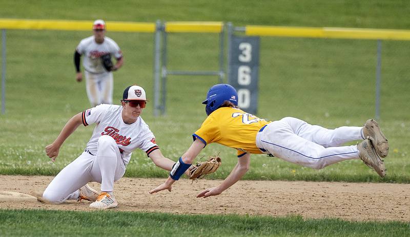 Byron’s Cooper Mershon tags out Johnsburg’s Deegan Turner Wednesday, May 28, 2025, in the Class 2A Sectional semifinal in Mendota.