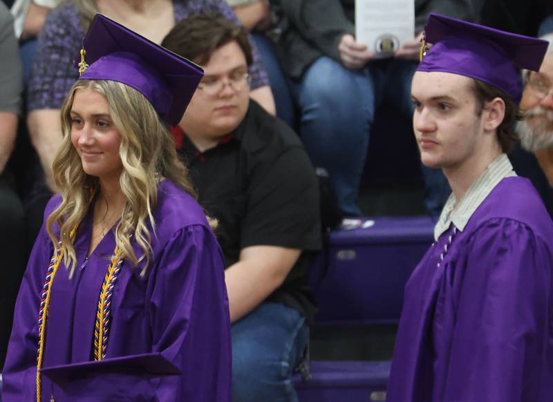 Serena High School graduates Kendall Whiteaker and Maximus Woods stand to receive their diplomas during the Serena High School Class of 2026 commencement ceremony on Saturday, May 23, 2026 at Serena High school.