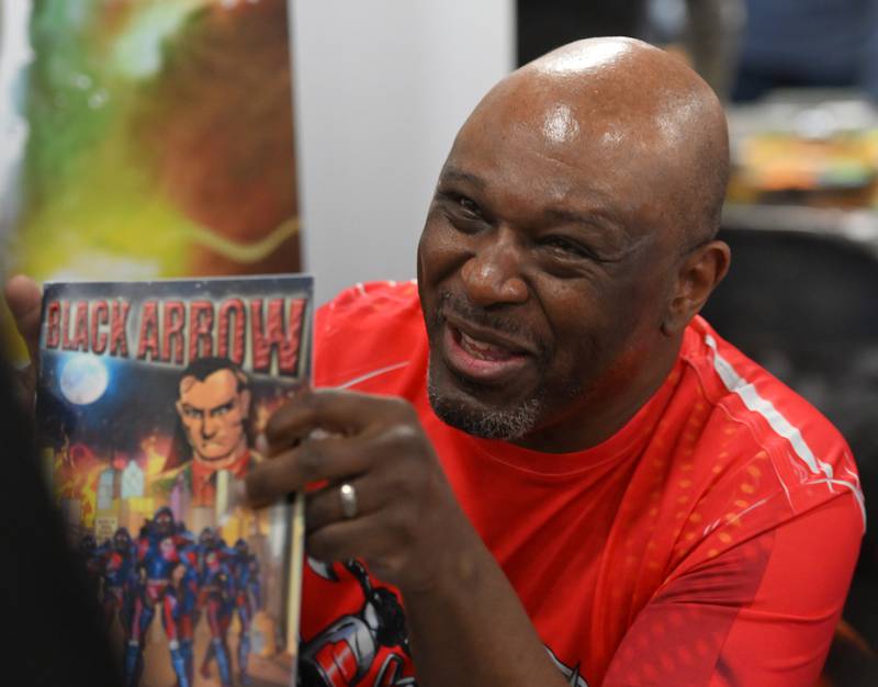 Comic writer Edward Sims talks about “Black Arrow” during the DuPage Comic Con, presented by Mighty Con, at the DuPage County Fairgrounds on  dow}, March 2, 2024 in Wheaton.