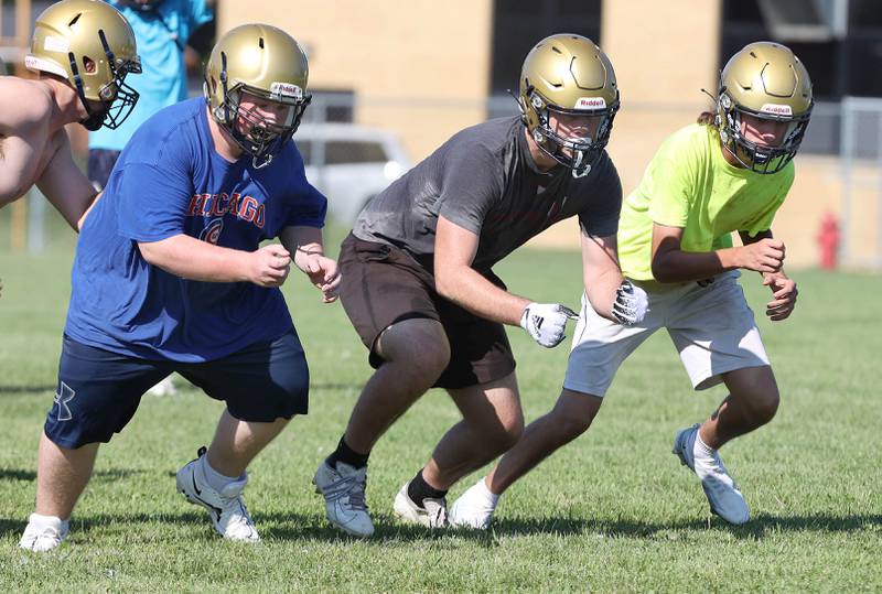 The Hiawatha offensive line gets off at the snap Wednesday, Aug.10, 2022, during practice at the school in Kirkland.