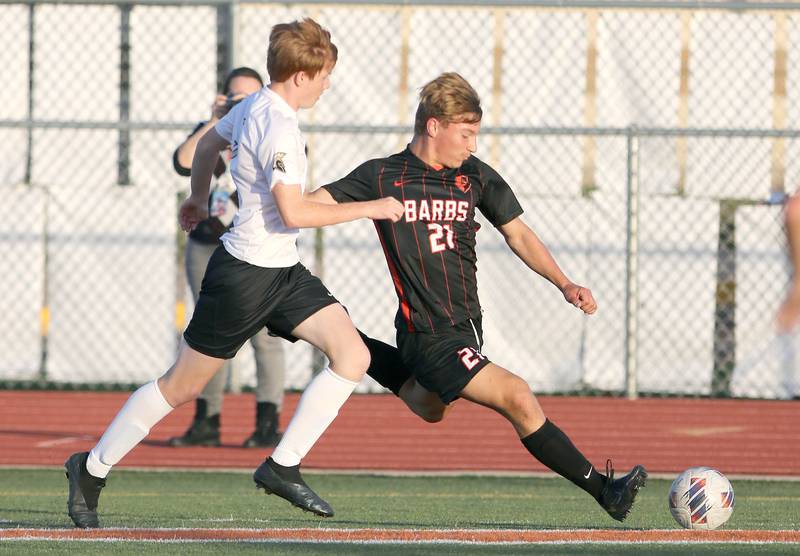 DeKalb's Sean Kolkebeck gets a shot off ahead of a Sycamore defender during their game Tuesday, Oct. 4, 2022, at DeKalb High School.
