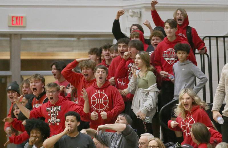 Hall students react after Mac Resetich dunks the ball against St. Bede on Monday, Dec. 14, 2022 at St. Bede Academy.