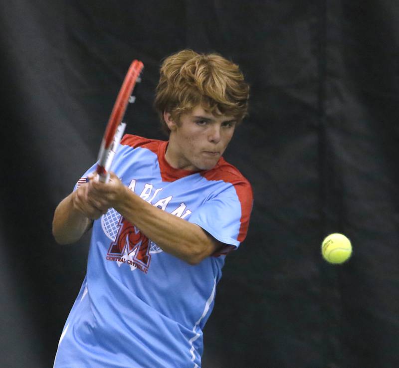 Marian Central’s Matthew Garretts returns the ball during a IHSA 1A boys double tennis match Thursday, May 26, 2022, at Midtown Athletic Club in Palatine.