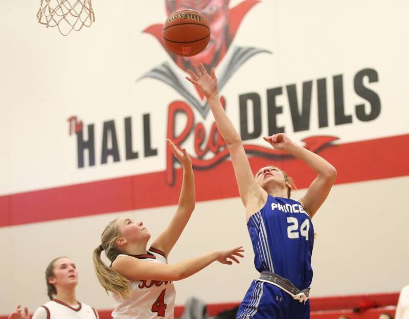 Princeton's Keighley Davis runs in the lane to score on a layup over Hall's Charlie Pellegrini on Thursday, Nov. 30, 2023 at Hall High School.