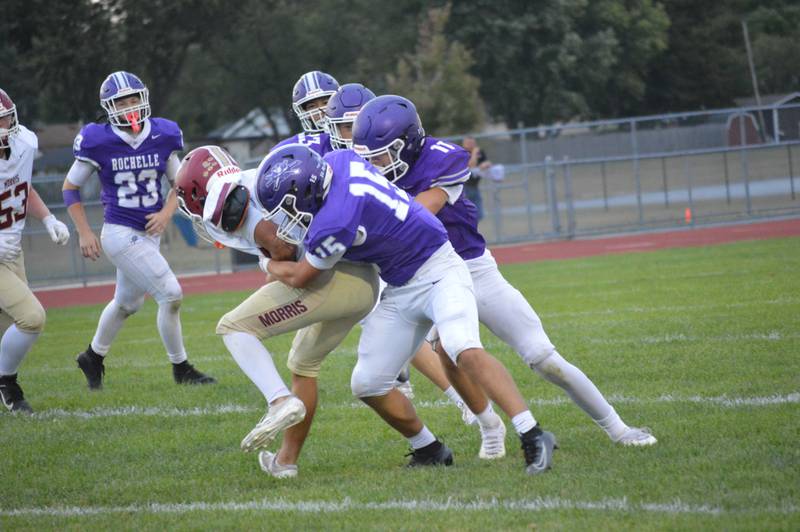 Rochelle's Maddox Hueramo (15) and Tyson Pavlack (11) tackle a Morris player during their junior varsity football game. Rochelle won the game 12-8.