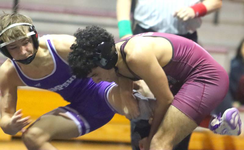 Prairie Ridge’s Majd Ramadan, right, battles Hampshire’s David Becker at 138 pounds in varsity boys wrestling on Thursday, Dec. 4, 2025, at  Prairie Ridge High School in Crystal Lake.