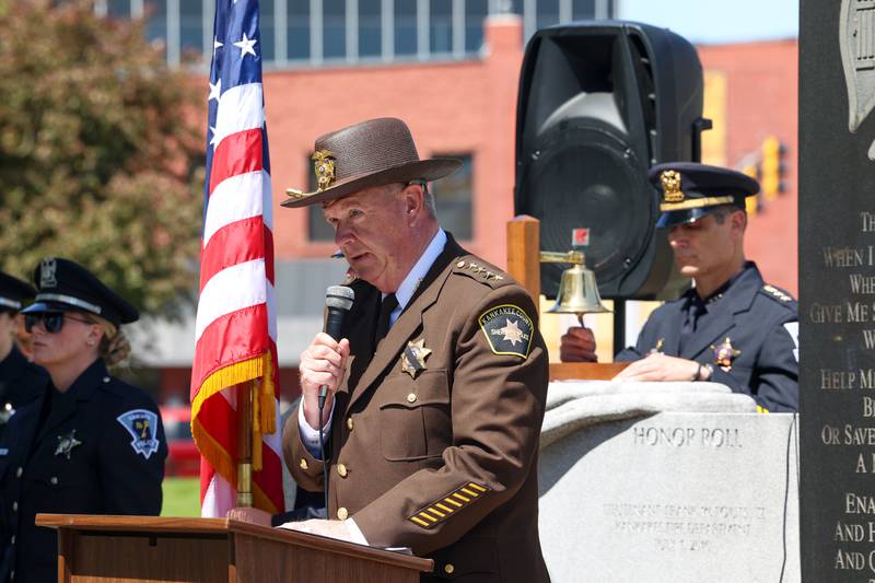 Kankakee County Sheriff Mike Downey reads the roll call of fallen officers during the Kankakee County Law Enforcement Memorial on Thursday, May 14, 2026, at the Kankakee County Courthouse.