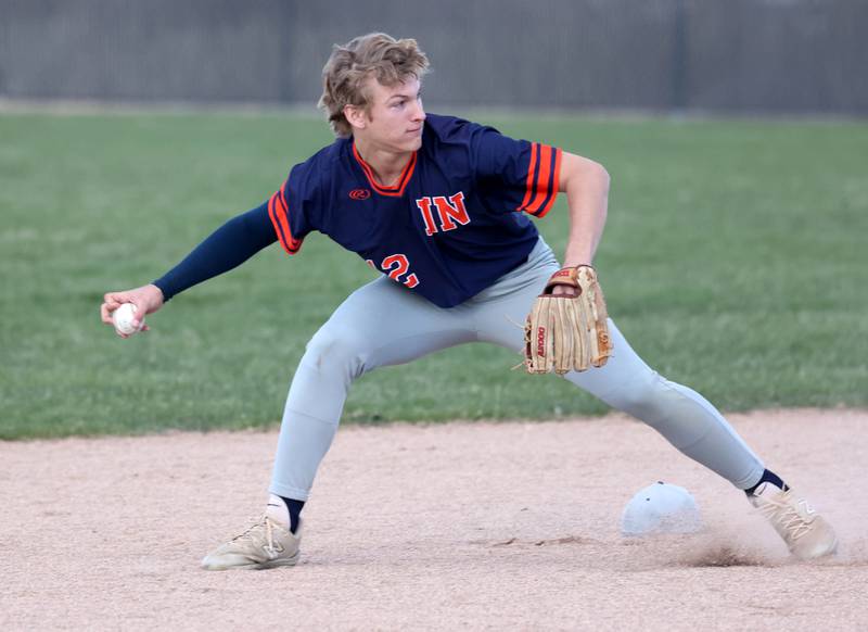Naperville North's Matt Sonnenschein looks to throw to first Tuesday, April 15, 2025, during their game at DeKalb High School.