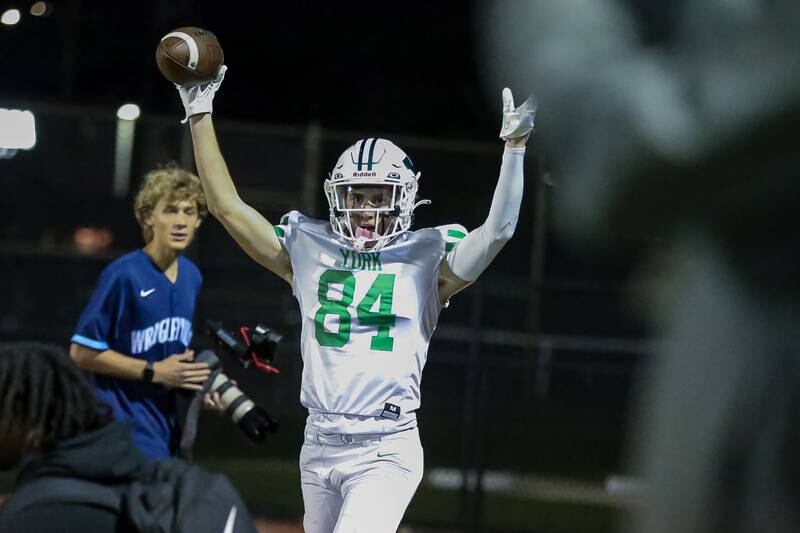 York's Luke Mallander (84) celebrates a touchdown reception during football game between York at Downers Grove North.  Sept 29, 2023.