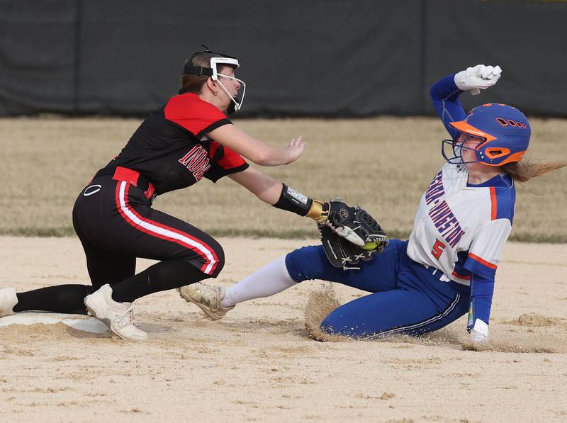 Indian Creek’s MaKenna Barshinger tags out Genoa-Kingston’s Abigail Fellows as she tries to steal second during their game Tuesday, March 18, 2025, at Indian Creek High School in Shabbona.