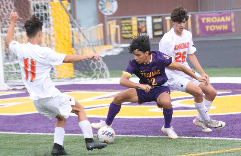 Mendota's Bryan Herrera kicks the ball between Winnebago defenders Wyatt Webb and Drew Intravaia on Wednesday, Oct. 4, 2023 at Mendota High School.