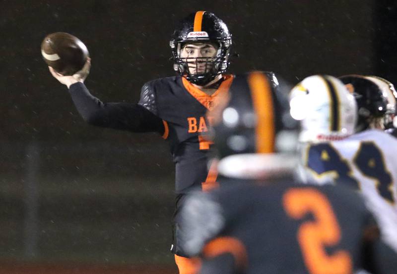 DeKalb's Adrien McVicar sidearms a pass to Jamari Brown during their game against Neuqua Valley Friday, Oct.14, 2022, at DeKalb High School.