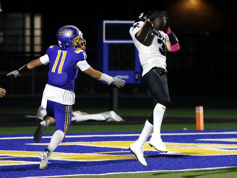 Woodstock North's Braeden Berner intercepts a pass intended for Johnsburg's Ryan Franze during a Kishwaukee River Conference football game on Friday, Sept. 26, 2025, at Johnsburg High School.