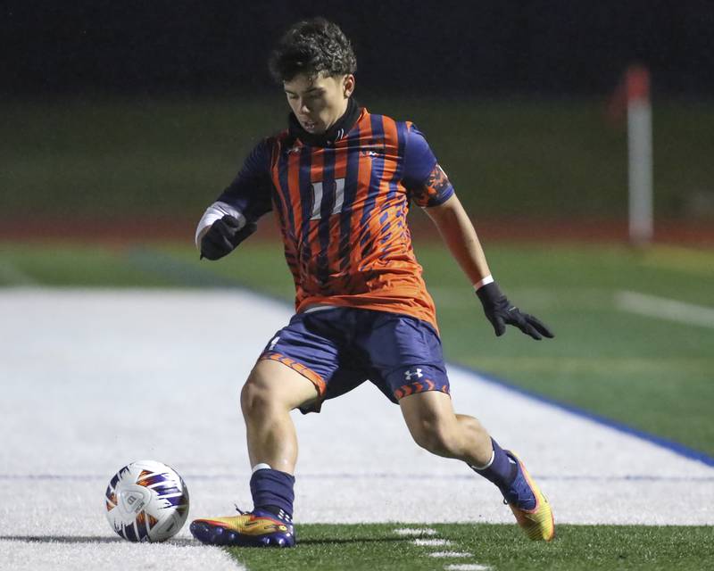 Oswego's Victor Rios (11) handles the ball during Class 3A Naperville Central Regional semifinal soccer match between Plainfield North at Oswego, Tuesday Oct 21, 2025.
