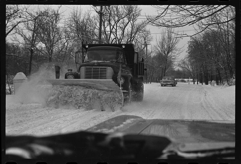 A snowplow clears a Joliet roadway in 1969.