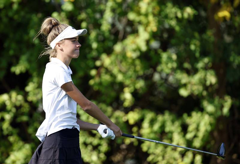 Bridget Brennan of Wheaton St. Francis, reacts to her drive during the IHSA Class 2A West Chicago girls golf regional at St. Andrews Tuesday, Oct. 1, 2024 in West Chicago.