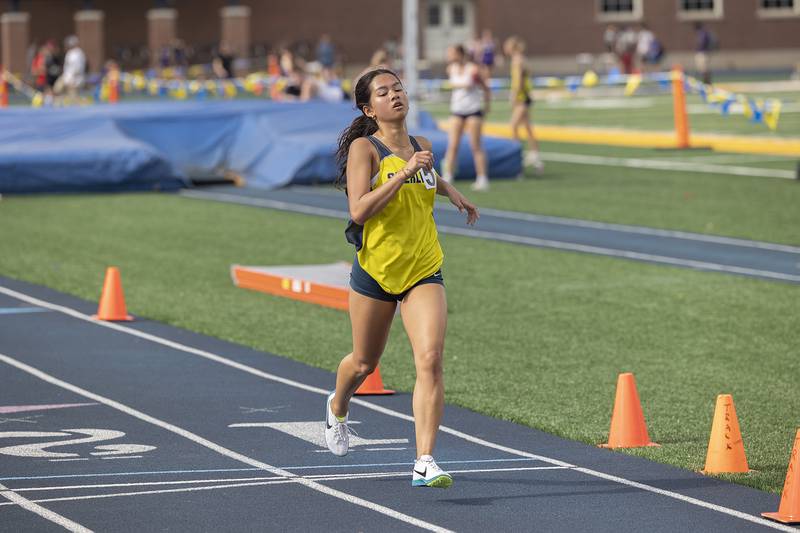 Sterling’s Emma Pham eyes the finish in the 3200 run Wednesday, May 14, 2025, during Sectionals at Sterling High School.