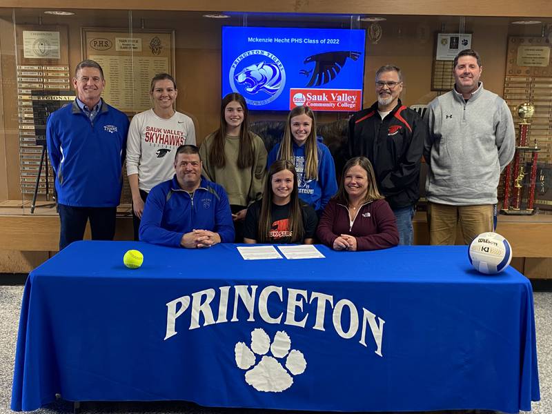 Princeton High School senior signed to play volleyball and softball for Sauk Valley Community College in Dixon. She was joined by her parents (front row) Jason and Eileen; and (back row) PHS softball coach Joe Bates, Sauk softball coach Chelsea Eads, her sisters, Makayla and Addie, Sauk volleyball coach Jay Howell and PHS volleyball coach Andy Puck.