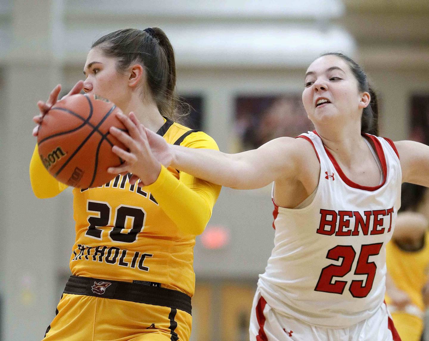 Brian Hill/bhill@dailyherald.com
Benet’s Samantha Trimberger (25) reaches for a rebound as Carmel's Mia Gillis (20) looks for an outlet Friday November 25, 2022 in Lisle.