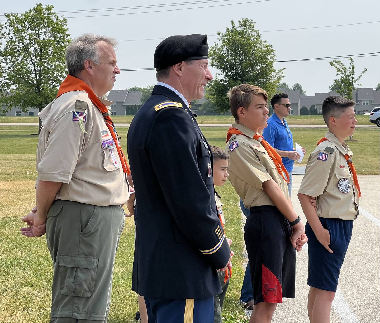 Scout Master of Troop 40, Ed Hollendoner, and Scouts Will Moore, Caden Mabel and  Nolan Cox stand next to retired U.S. Army Lieutenant Colonel during the 2023 Flag Day Celebration in Sycamore on June 14, 2023.