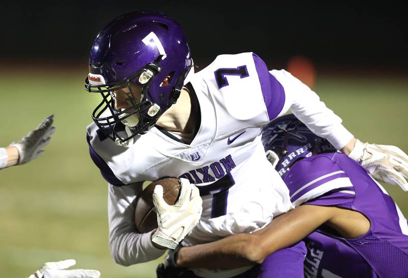 Dixon’s Ethan Hays picks up yardage after a catch during their first round playoff game against Rochelle Friday, Oct. 28, 2022, at Rochelle High School.