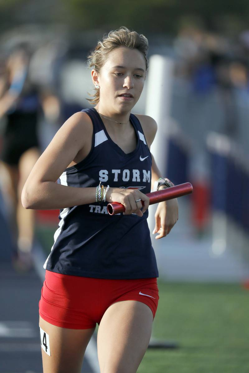 Piper Engel of South Elgin in the Girls 4x800 Meter Relay during the Kane County girls track and field meet Thursday April 27, 2023 in Aurora.