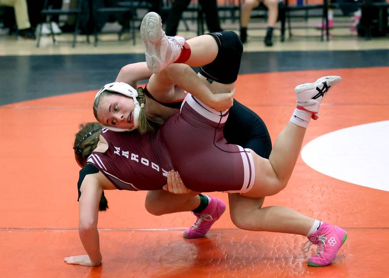 DeKalb’s Lana Zimmerman lifts Moline’s Brianna Blunt Wednesday, Nov. 27, 2024, during their 140 pound match at DeKalb High School. Zimmerman went on to pin Blunt.