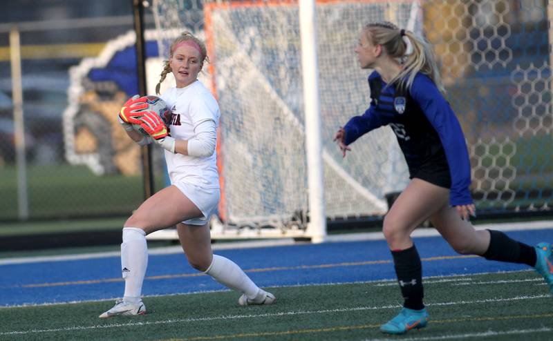 Batavia goalkeeper Aubrey Hahn grabs the ball during a Tri-Cities Night game against Geneva at Geneva High School on Tuesday, April 26, 2022.
