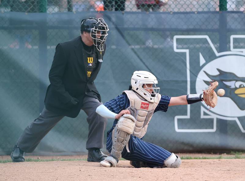 Nazareth's Nick Drtina (9) catches during the varsity baseball game between Benet Academy and Nazareth Academy in La Grange Park on Monday, April 24, 2023.
