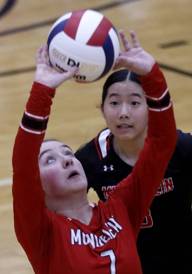 Mundelein's Bella Snow sets the ball in front of her teammate, Sarah Choi, during an IHSA Class 4A McHenry Sectional volleyball match against Huntley on Tuesday, Nov. 5, 2024, at McHenry High School Freshman Campus.