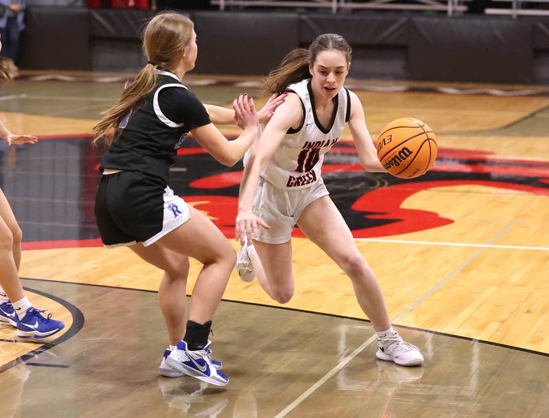 Indian Creek's Ally Keilman drives past a Rosary defender Tuesday, Feb. 10, 2026, during their game at Indian Creek High School in Shabbona.